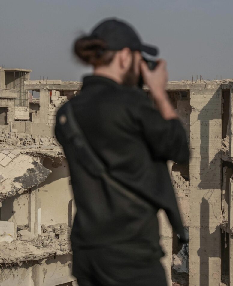 hotographer documenting the war impact on tourism in a conflict-affected destination.
